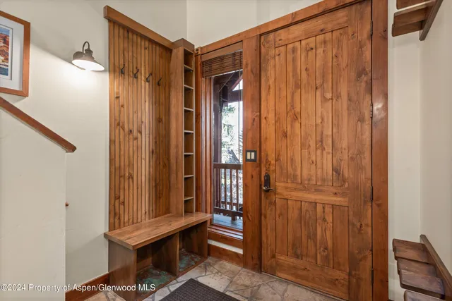 a view of a elevator with wooden floor