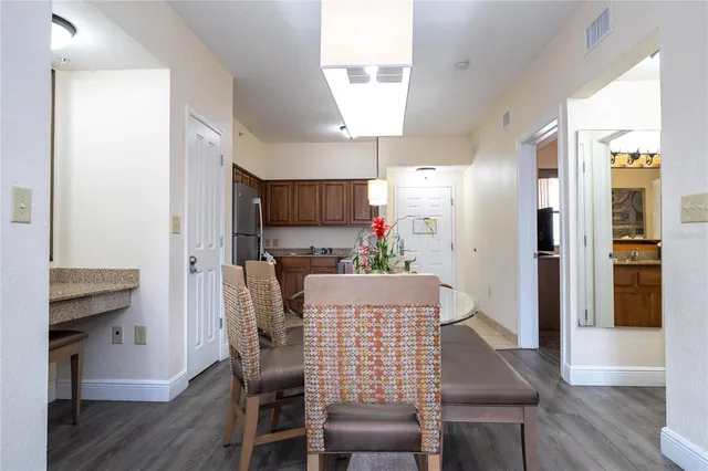 a living room with furniture and a lamp
