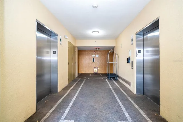 a kitchen with cabinets and stainless steel appliances