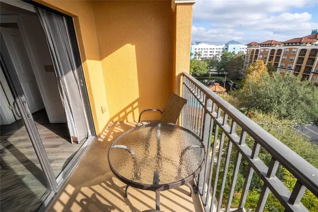 a bedroom with a bed and lamp