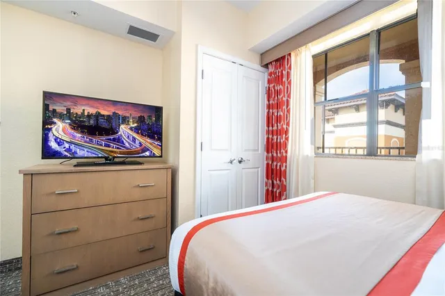 a bathroom with a granite countertop sink a mirror and shower