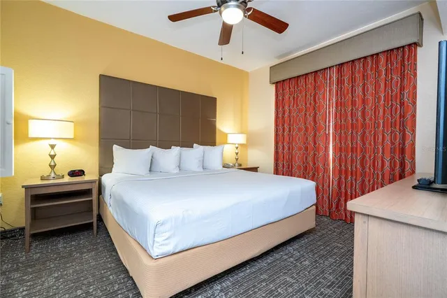 a bathroom with a bathtub and a window