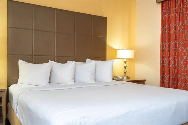 a bedroom with a bed and a view of bathroom