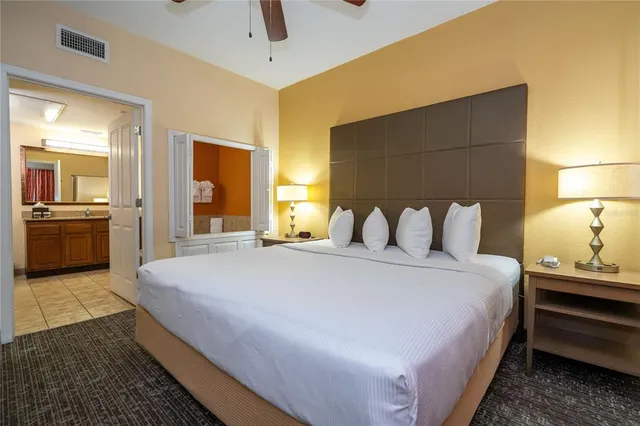 a front view of a residential apartment building with a yard