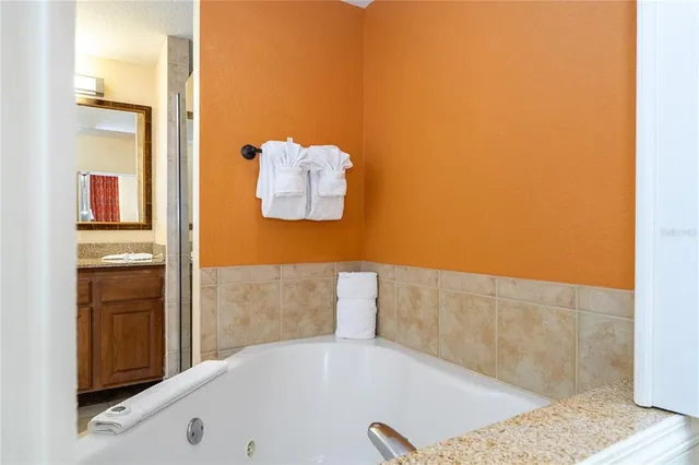 a living room with furniture gym equipment and a large window