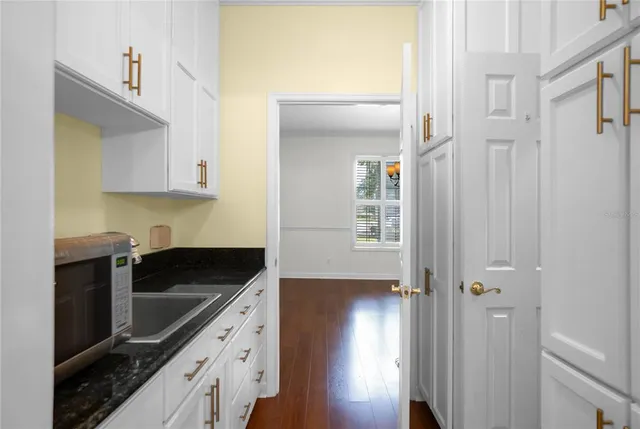 a room with sink and mirror