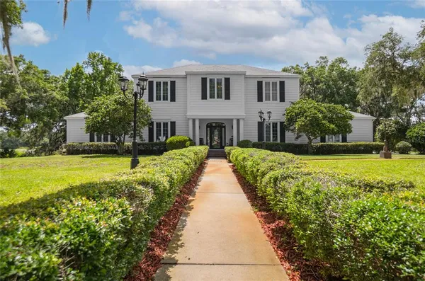 a view of a room with a window and chandelier