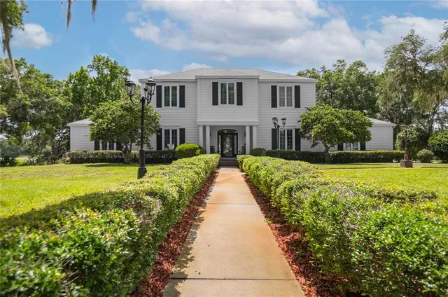 a view of a room with a window and chandelier
