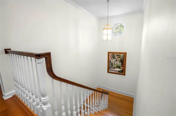 a view of livingroom with hardwood floor and a ceiling fan