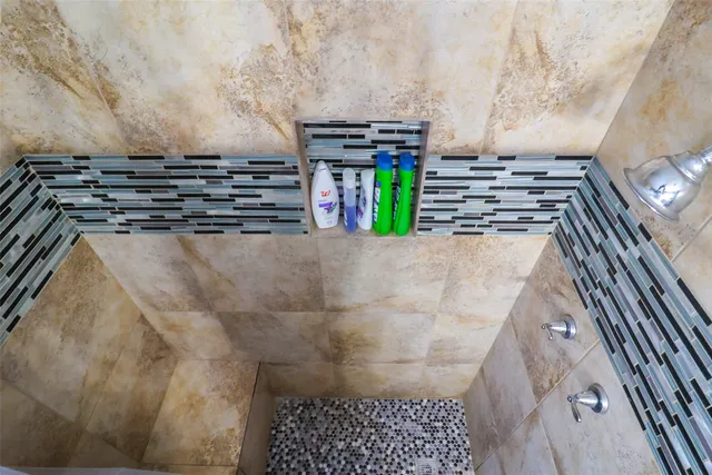 a bathroom with a toilet a sink and a mirror