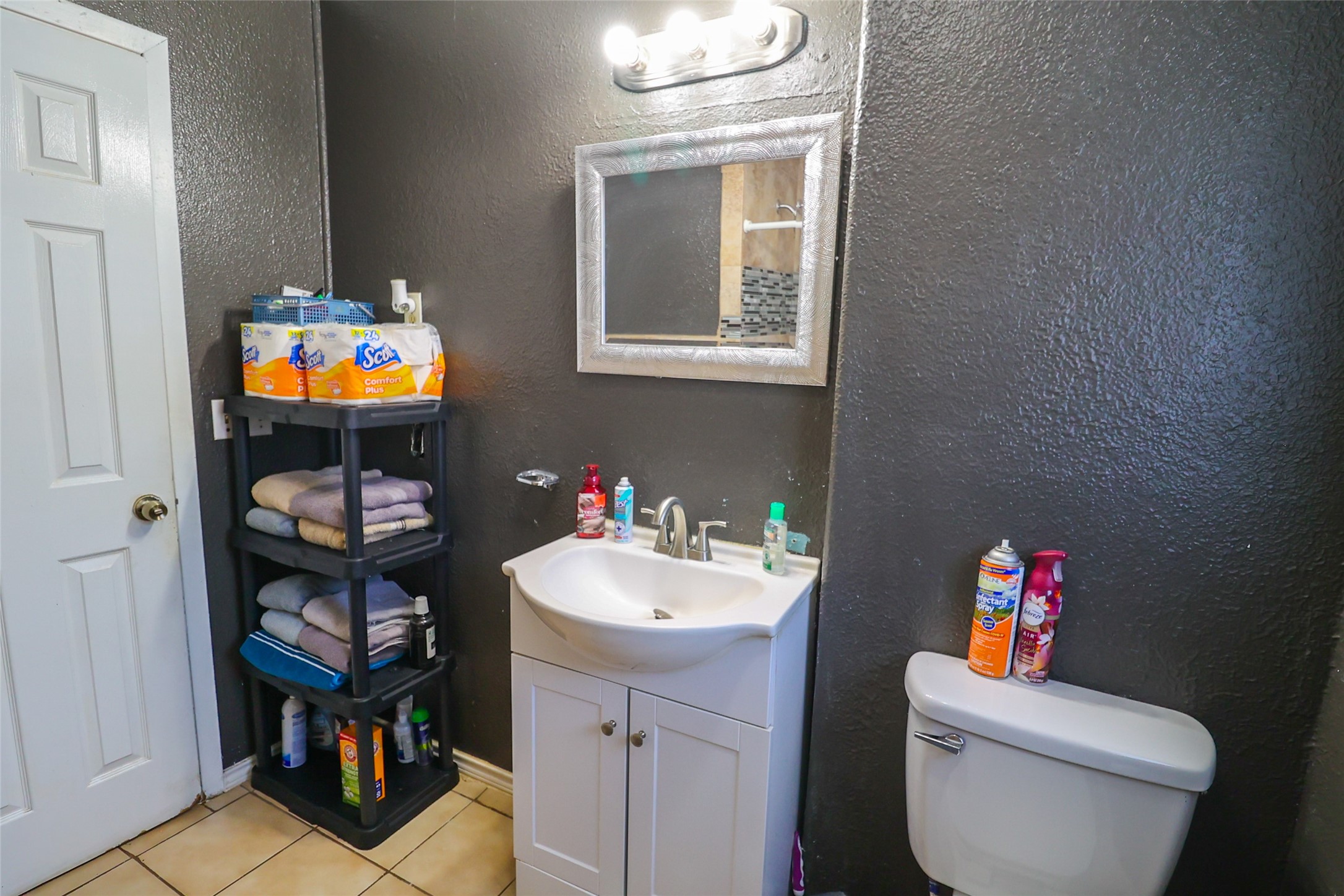 416 Clara Road South Houston, TX 77587 - Photo 17 of 50 a bathroom with a toilet a sink and a mirror