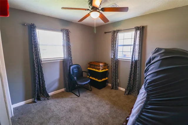 a view of water heater room with a window