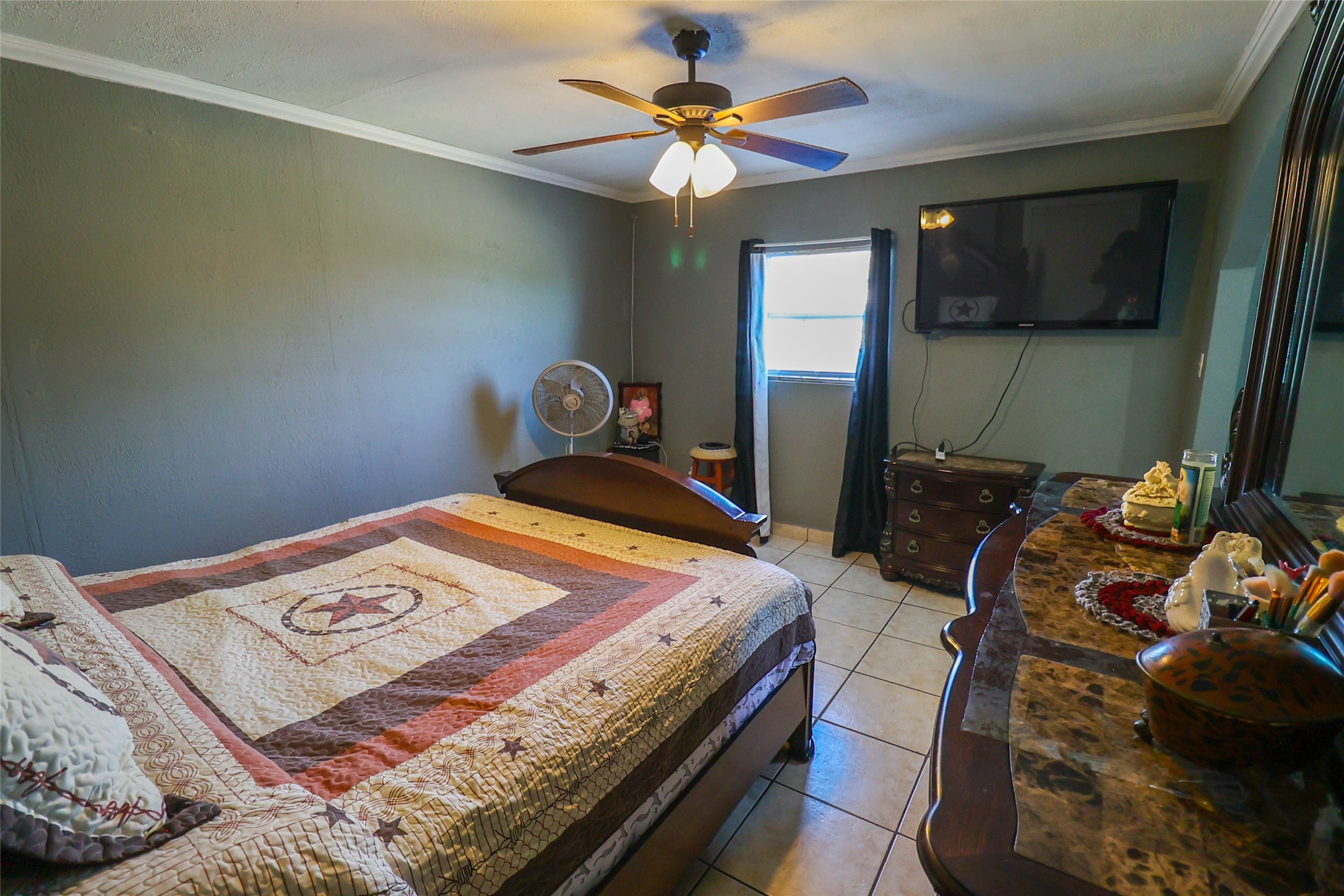 416 Clara Road South Houston, TX 77587 - Photo 27 of 50 a bedroom with a bed and a chandelier