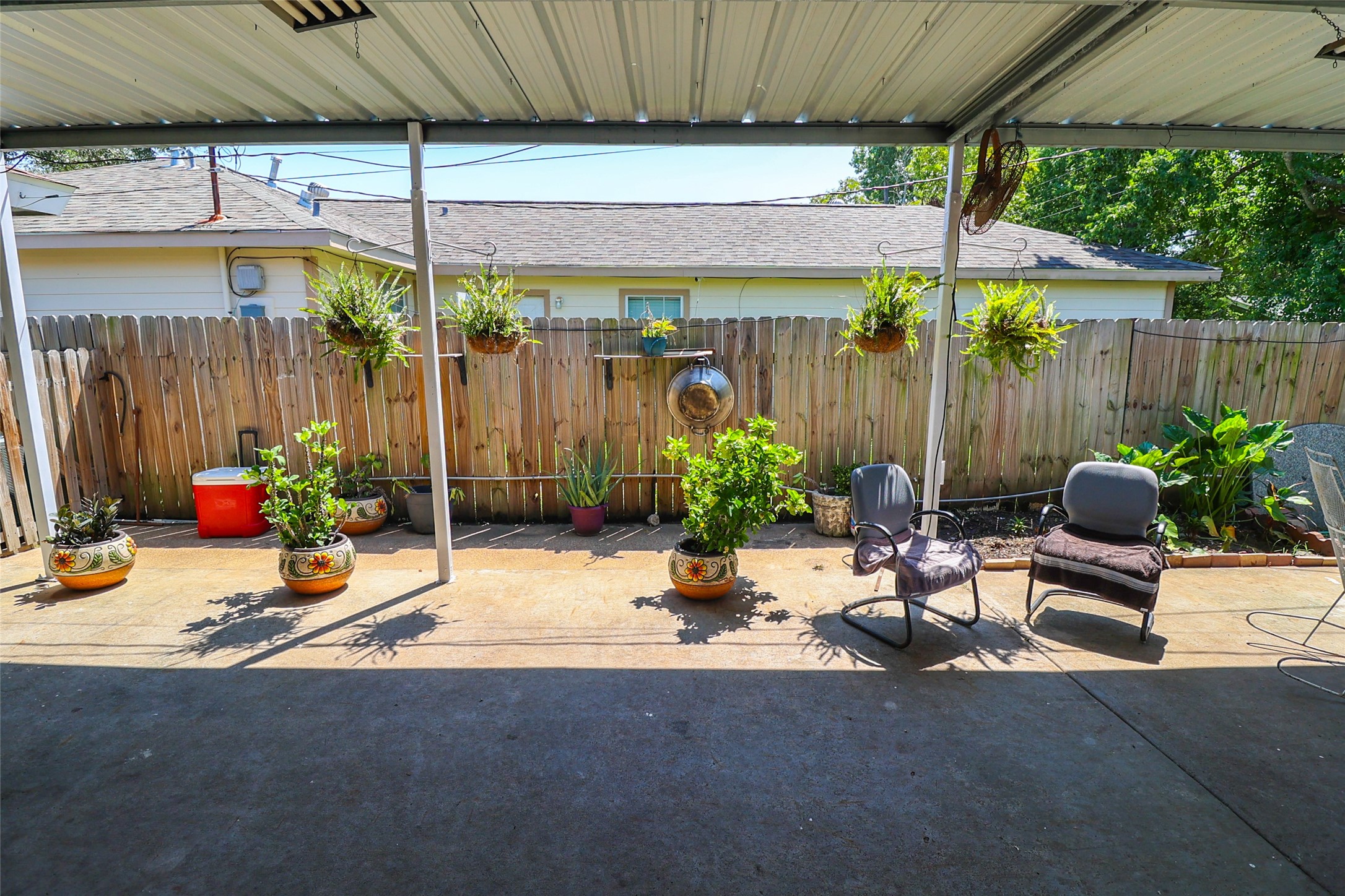 416 Clara Road South Houston, TX 77587 - Photo 45 of 50 a view of a patio with table and chairs under an umbrella