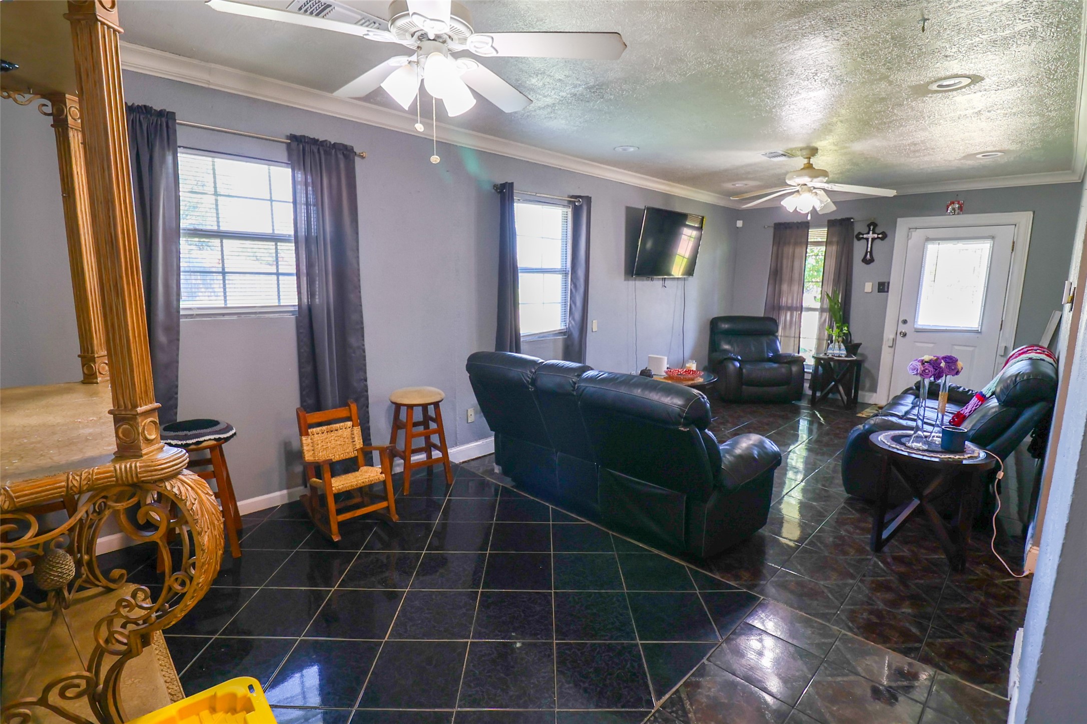 416 Clara Road South Houston, TX 77587 - Photo 6 of 50 a living room with furniture a chandelier and a flat screen tv