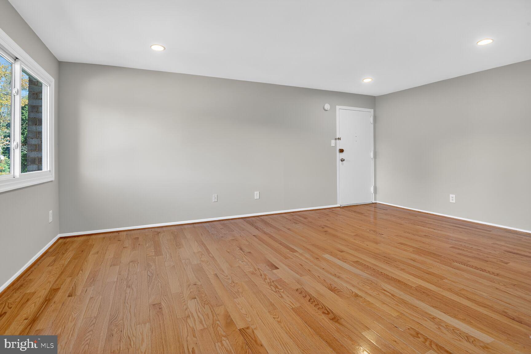 2907 Charing Cross Road, Unit 14 Falls Church, VA 22042 - Photo 3 of 15 a view of empty room with wooden floor and fan