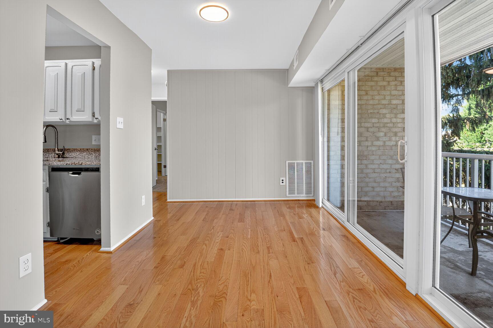 2907 Charing Cross Road, Unit 14 Falls Church, VA 22042 - Photo 6 of 15 wooden floor in an empty room with a window