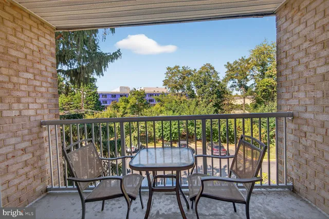 a view of a balcony with chairs