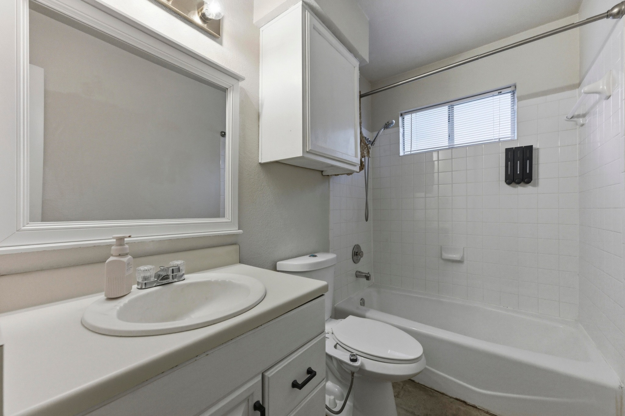 723 Shade Tree Drive Austin, TX 78748 - Photo 16 of 29 a bathroom with a sink toilet and shower