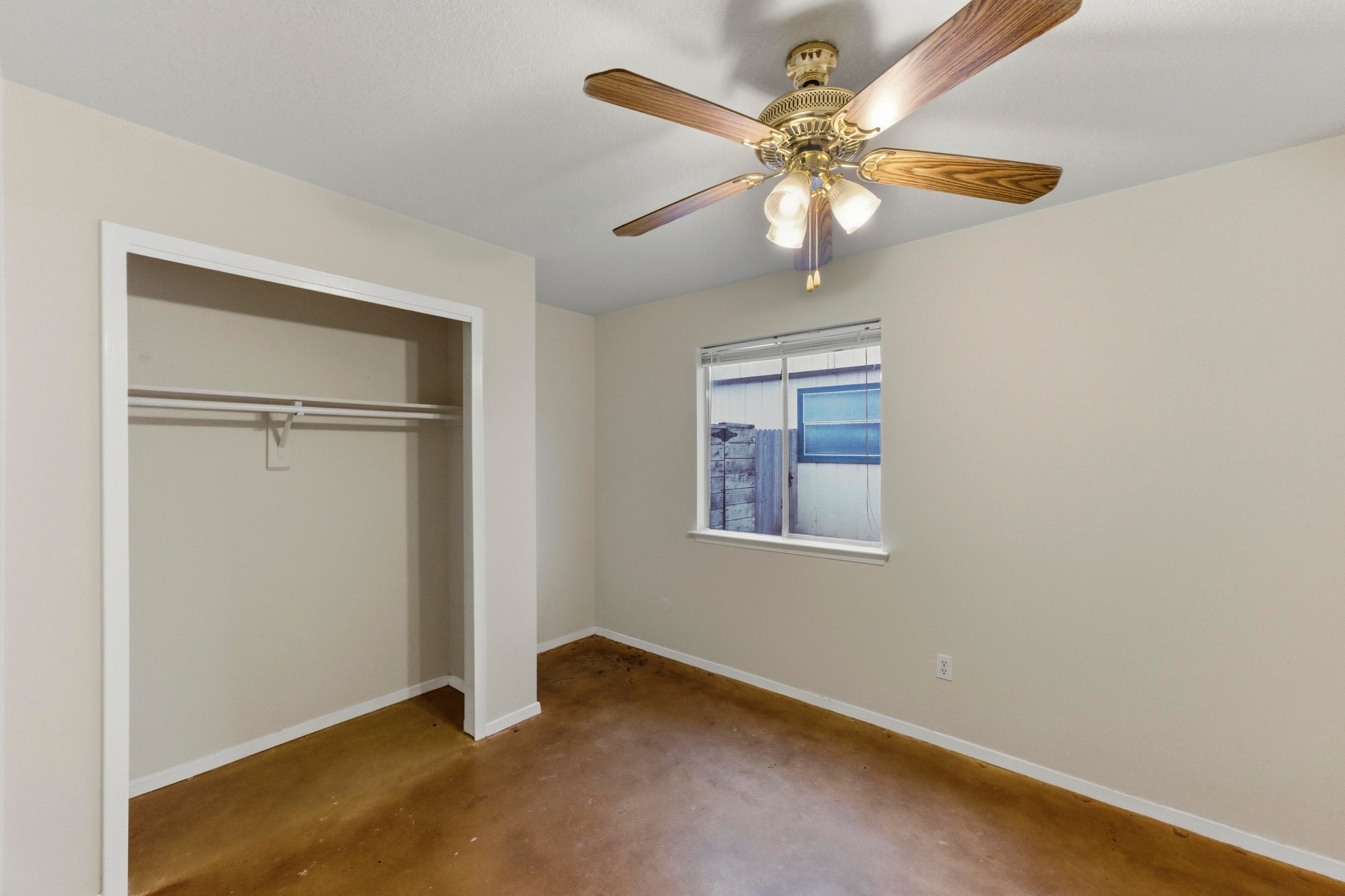 723 Shade Tree Drive Austin, TX 78748 - Photo 17 of 29 an empty room with windows and fan