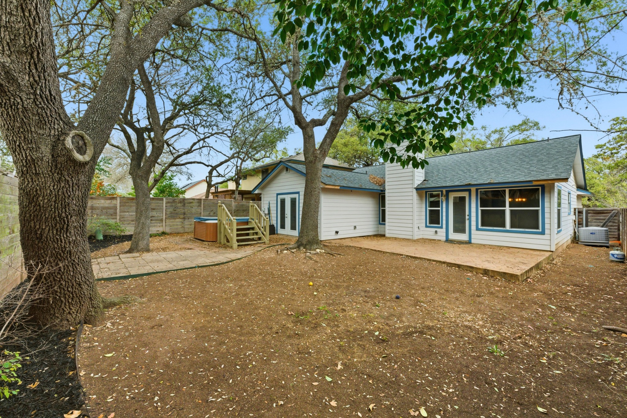 723 Shade Tree Drive Austin, TX 78748 - Photo 19 of 29 a view of a house with a tree in the background