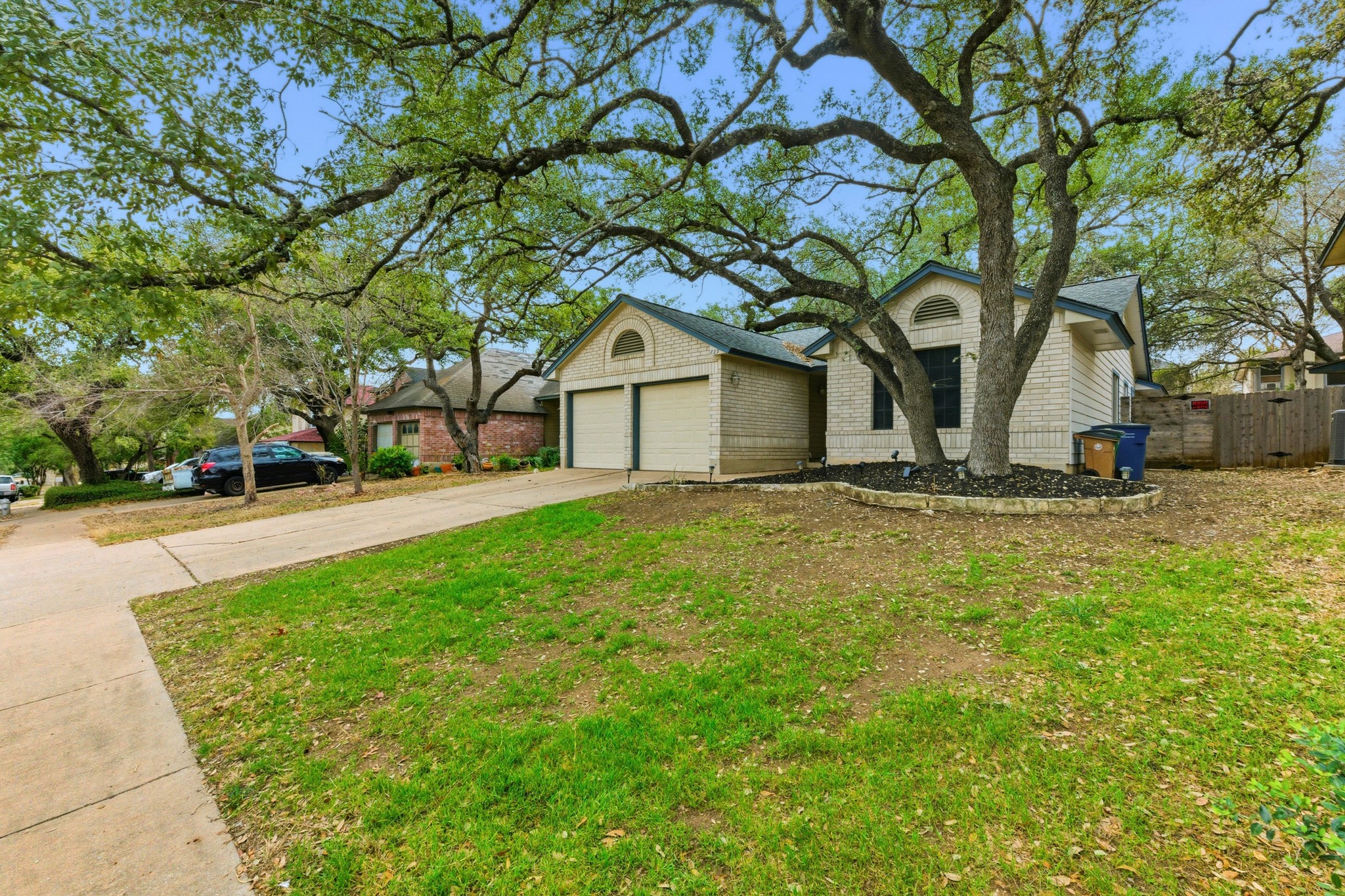 723 Shade Tree Drive Austin, TX 78748 - Photo 2 of 29 a front view of a house with a yard