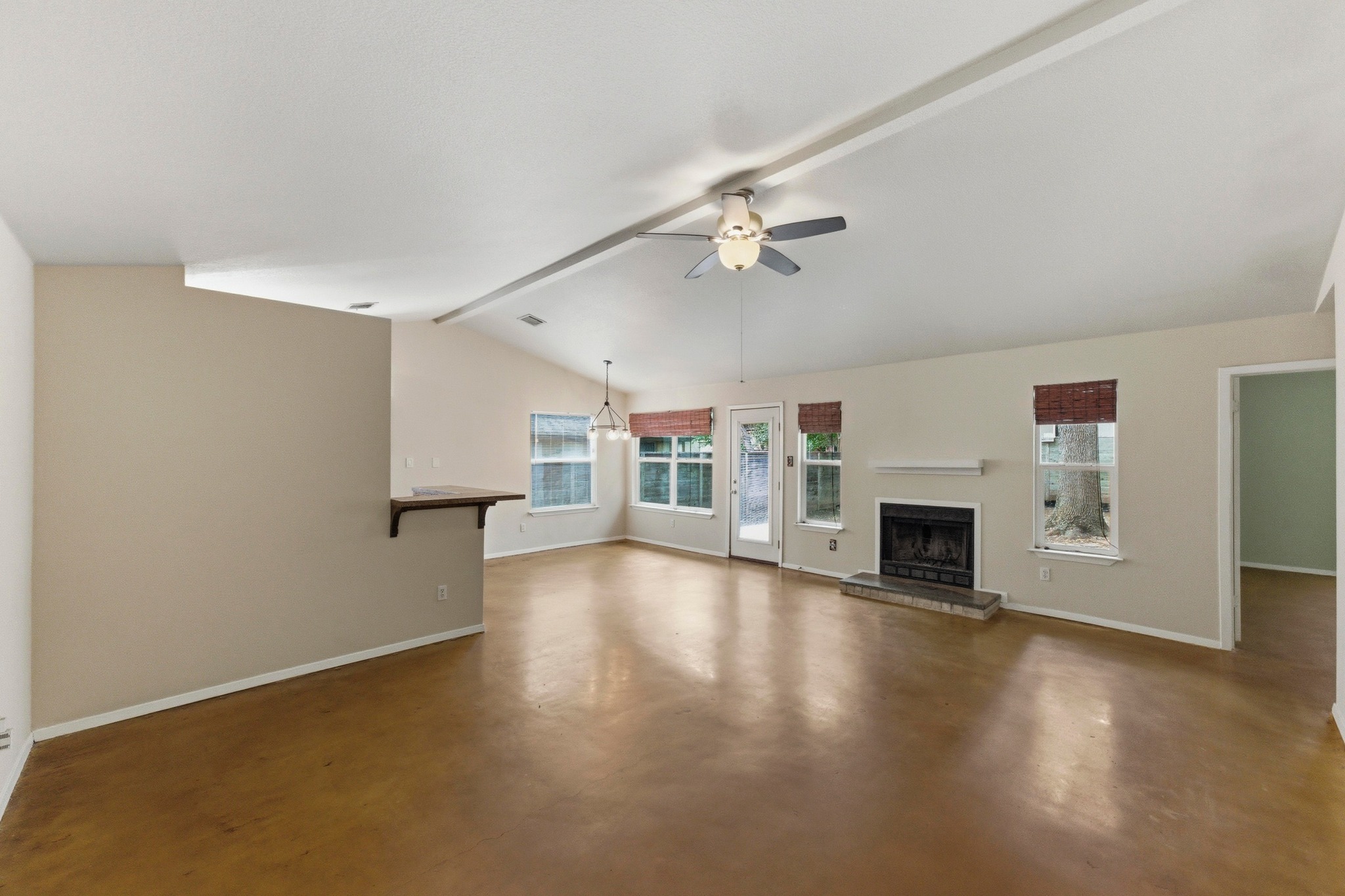 723 Shade Tree Drive Austin, TX 78748 - Photo 3 of 29 a view of empty room with fireplace and wooden floor