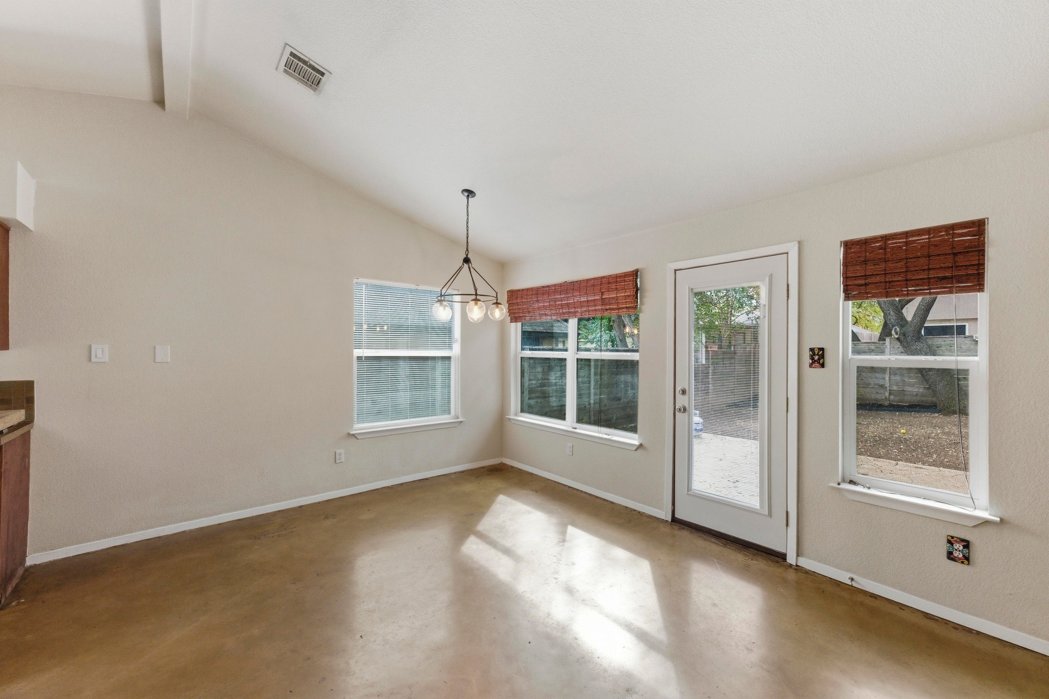 723 Shade Tree Drive Austin, TX 78748 - Photo 6 of 29 a view of an empty room with a window
