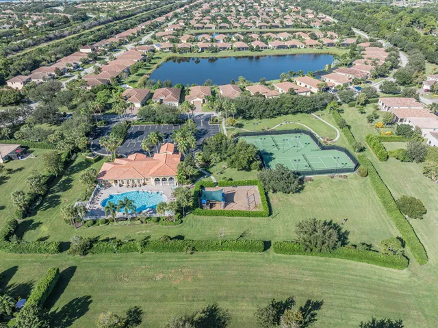 an aerial view of a houses with a yard
