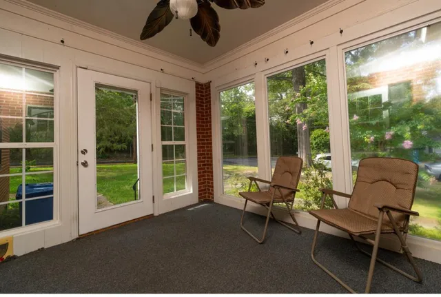a living room with furniture and windows
