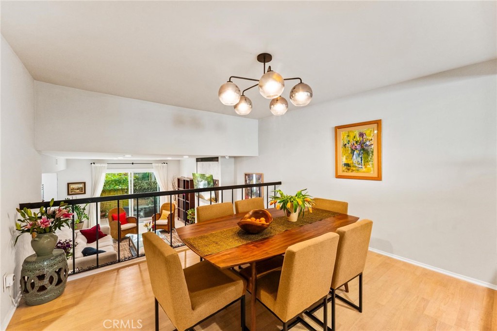 13243 Fiji Way, Unit K Marina del Rey, CA 90292 - Photo 16 of 39 a view of a dining room with furniture and a chandelier