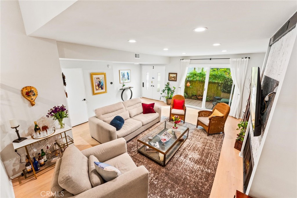 13243 Fiji Way, Unit K Marina del Rey, CA 90292 - Photo 18 of 39 a living room with furniture rug and a large window