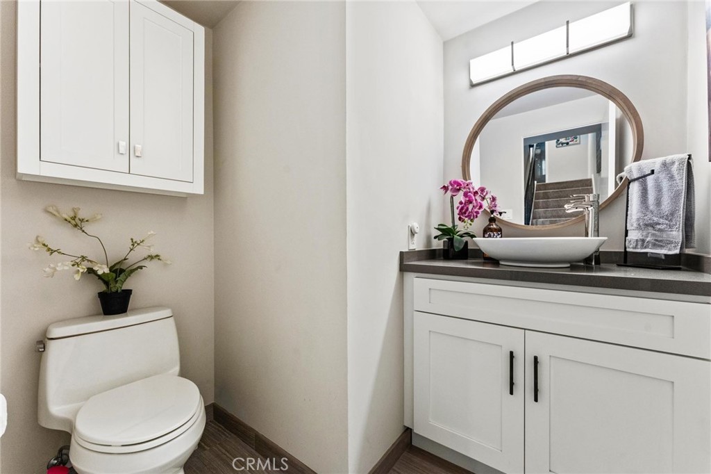 13243 Fiji Way, Unit K Marina del Rey, CA 90292 - Photo 19 of 39 a bathroom with a toilet sink and mirror