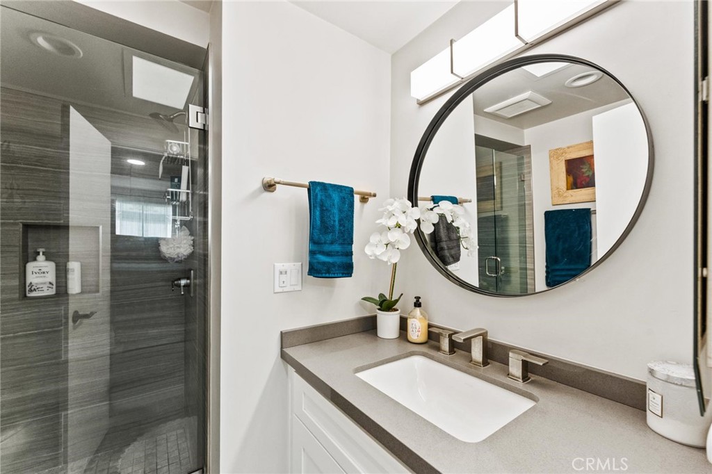13243 Fiji Way, Unit K Marina del Rey, CA 90292 - Photo 21 of 39 a bathroom with a sink and a mirror