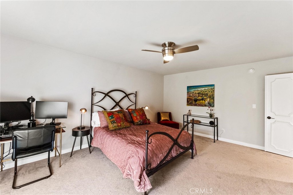 13243 Fiji Way, Unit K Marina del Rey, CA 90292 - Photo 23 of 39 a bedroom with a bed and a chair