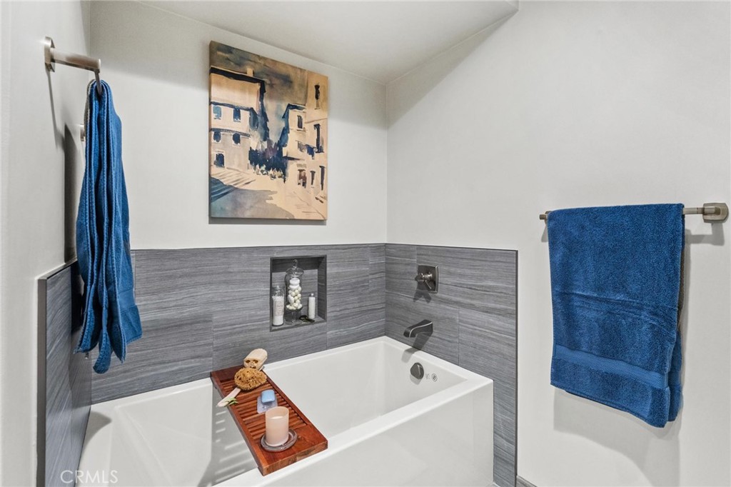 13243 Fiji Way, Unit K Marina del Rey, CA 90292 - Photo 31 of 39 a bathroom with a tub and a shower
