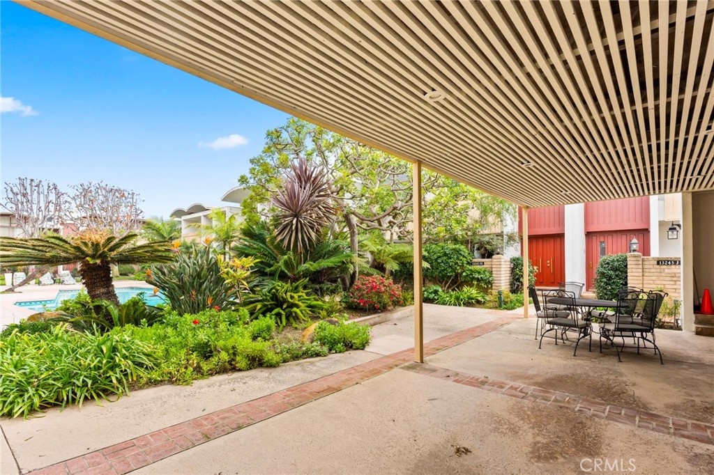 13243 Fiji Way, Unit K Marina del Rey, CA 90292 - Photo 38 of 39 a view of a patio with table and chairs and potted plants