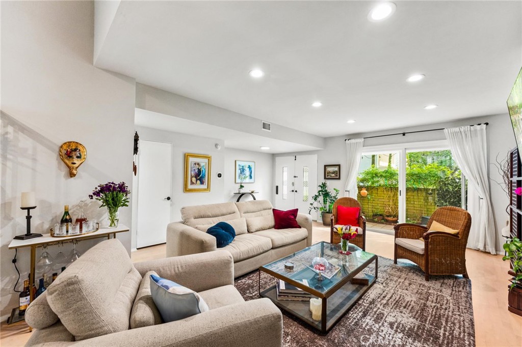 13243 Fiji Way, Unit K Marina del Rey, CA 90292 - Photo 4 of 39 a living room with furniture and a large window