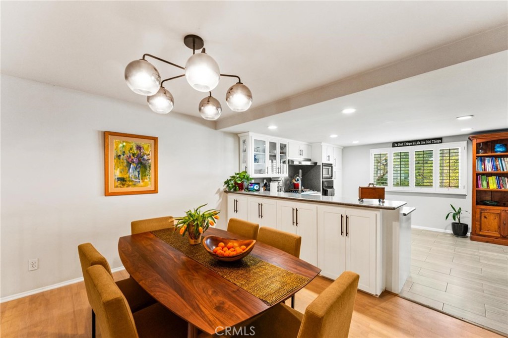 13243 Fiji Way, Unit K Marina del Rey, CA 90292 - Photo 7 of 39 a kitchen with a dining table and chairs