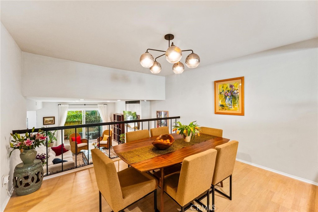 13243 Fiji Way, Unit K Marina del Rey, CA 90292 - Photo 9 of 39 a view of a dining room with furniture and a chandelier