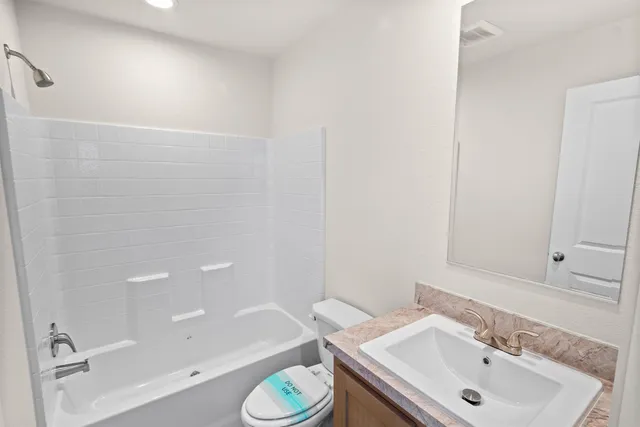 a bathroom with a sink and a toilet