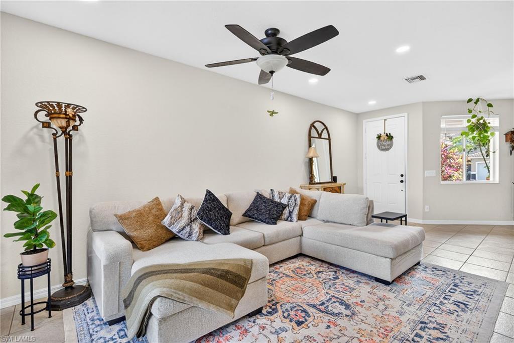 9530 Roundstone Circle Fort Myers, FL 33967 - Photo 1 of 35 a living room with furniture and a potted plant