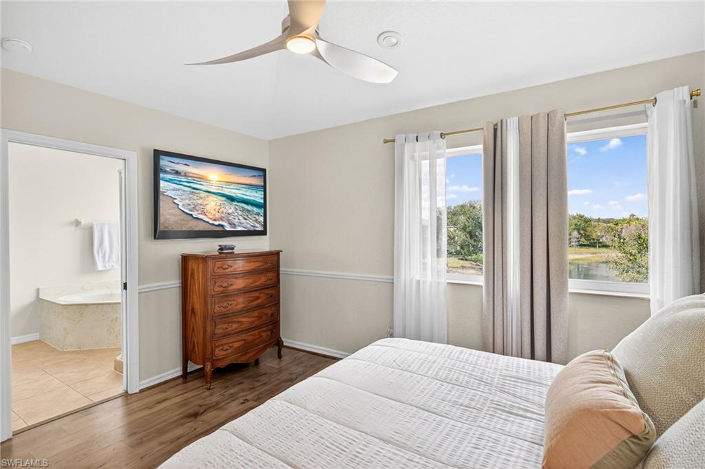 9530 Roundstone Circle Fort Myers, FL 33967 - Photo 11 of 35 a bedroom with furniture and a flat screen tv