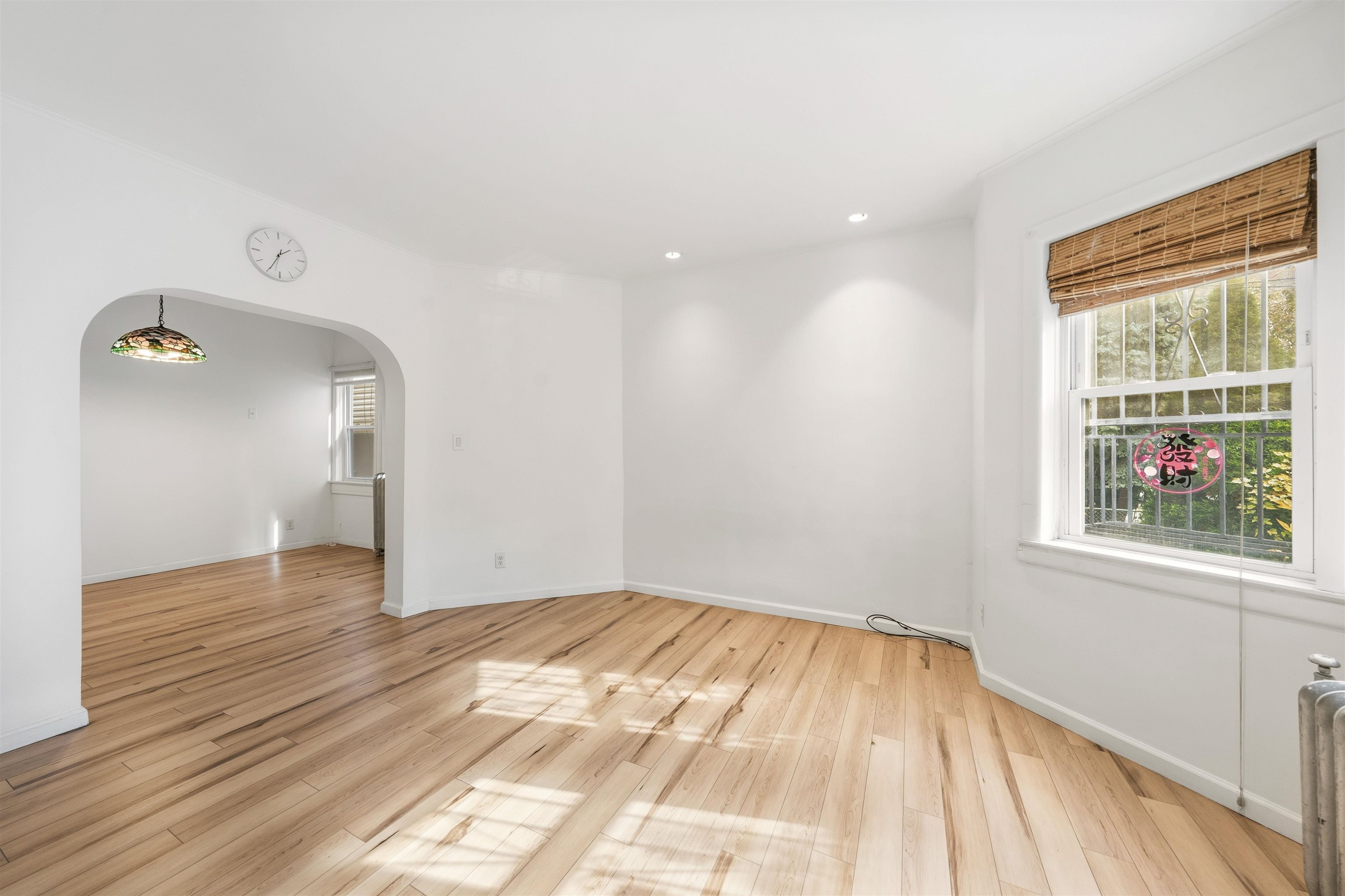 124 73rd Street, Unit 1 North Bergen, NJ 07047 - Photo 13 of 21 a view of empty room with wooden floor and fan