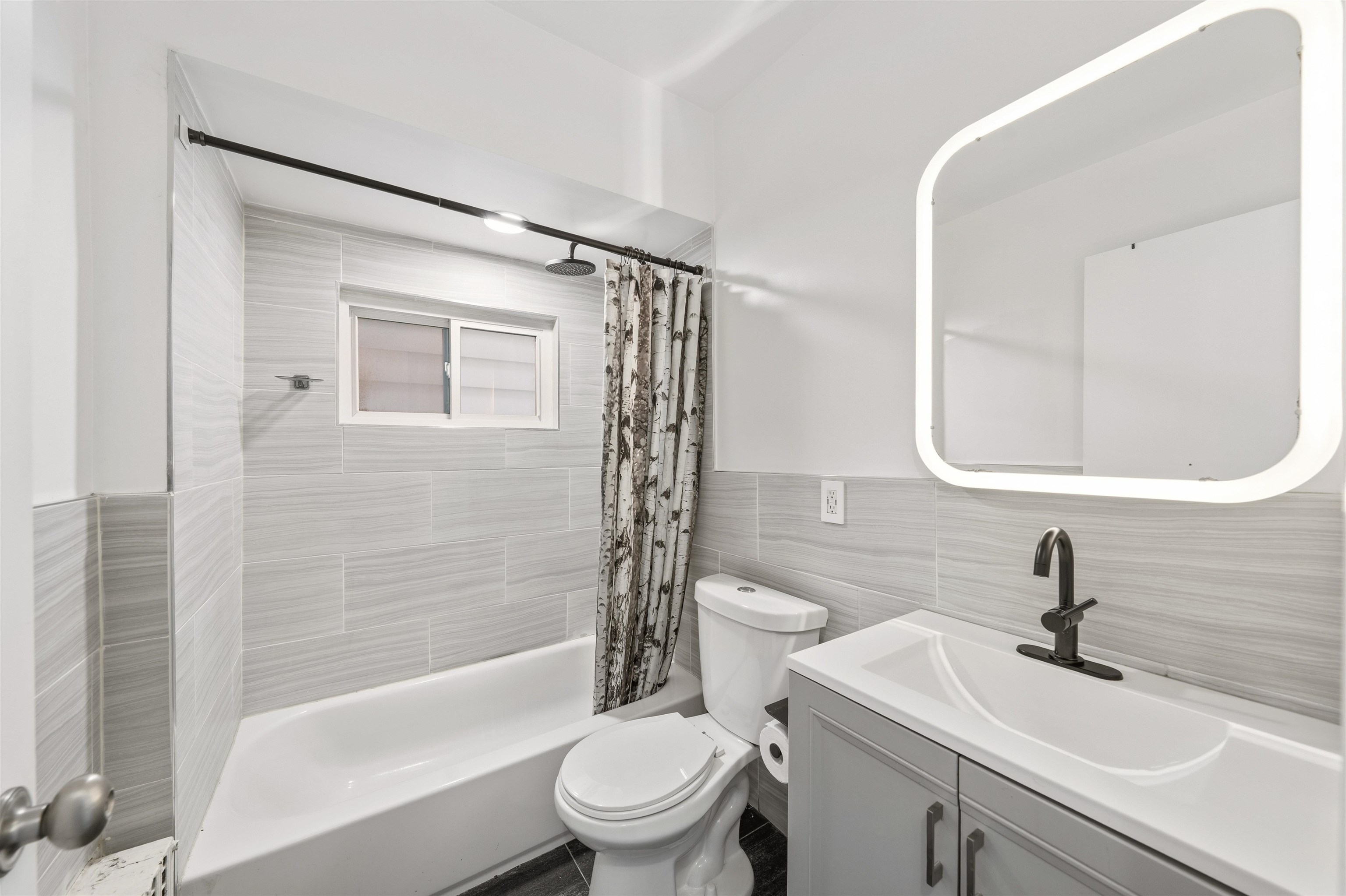 124 73rd Street, Unit 1 North Bergen, NJ 07047 - Photo 6 of 21 a bathroom with a sink toilet and shower