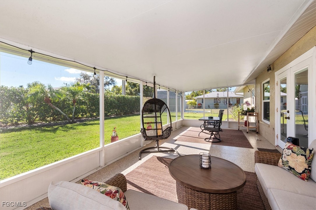 2124 Northeast 3rd Terrace Cape Coral, FL 33909 - Photo 14 of 32 a view of a living room and floor to ceiling window