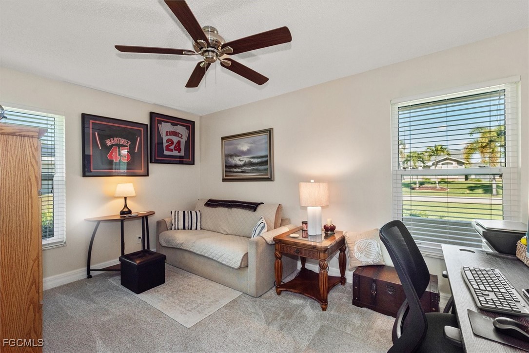 2124 Northeast 3rd Terrace Cape Coral, FL 33909 - Photo 24 of 32 a living room with furniture and a window