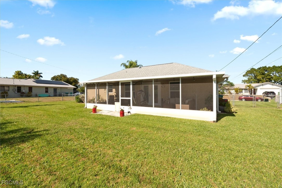 2124 Northeast 3rd Terrace Cape Coral, FL 33909 - Photo 30 of 32 a view of a house with a yard and sitting area