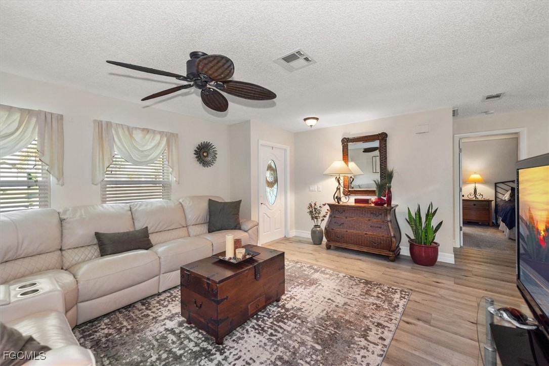 2124 Northeast 3rd Terrace Cape Coral, FL 33909 - Photo 5 of 32 a living room with furniture