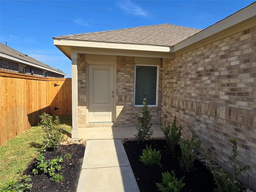 1114 Rustic Willow Drive Beasley, TX 77417 - Photo 2 of 9 a front view of a house with a yard